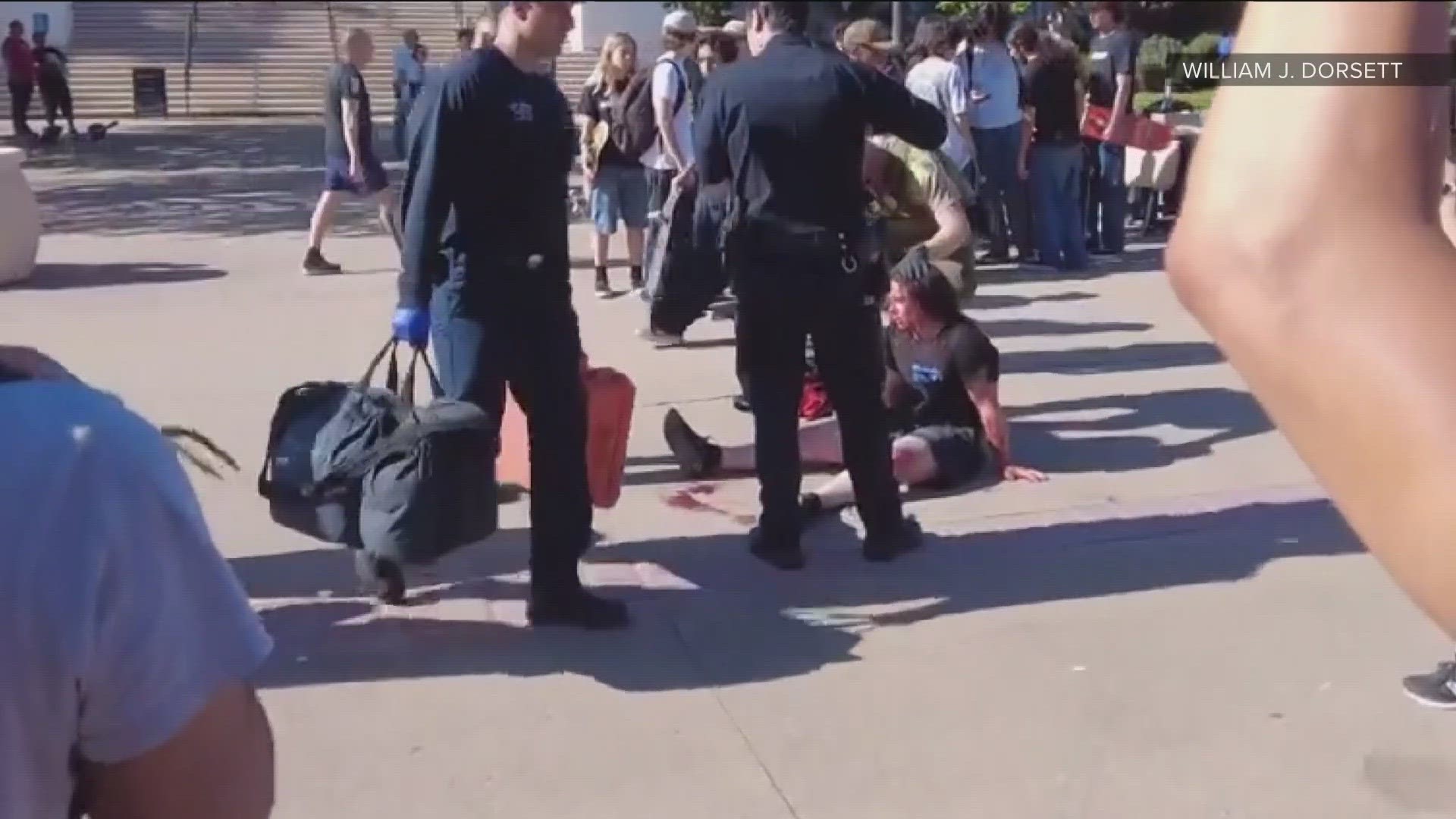 Authorities are searching for several skateboarders accused of bashing a parkgoer in the head after he refused to give up the area to hundreds of skateboarders.