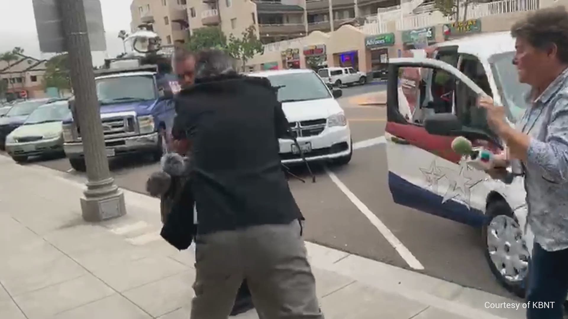 Video from another San Diego news station shows the business owner striking several reporters and camera operators on Monday. La Mesa police responded to the scene.