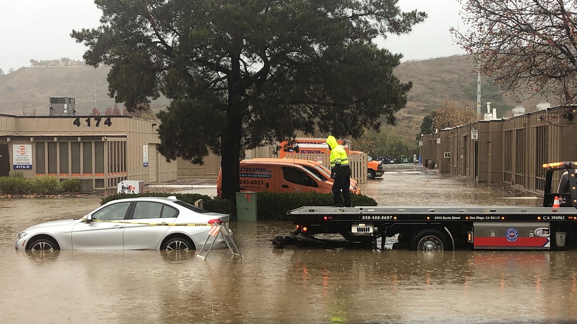 Total Loss: BMW driver rescued from flood waters in Sorrento Valley ...