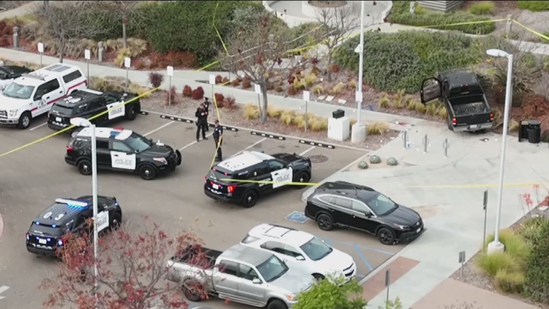 The shooting occurred after a woman tried to run over officers in front of the El Cajon police station with a vehicle.