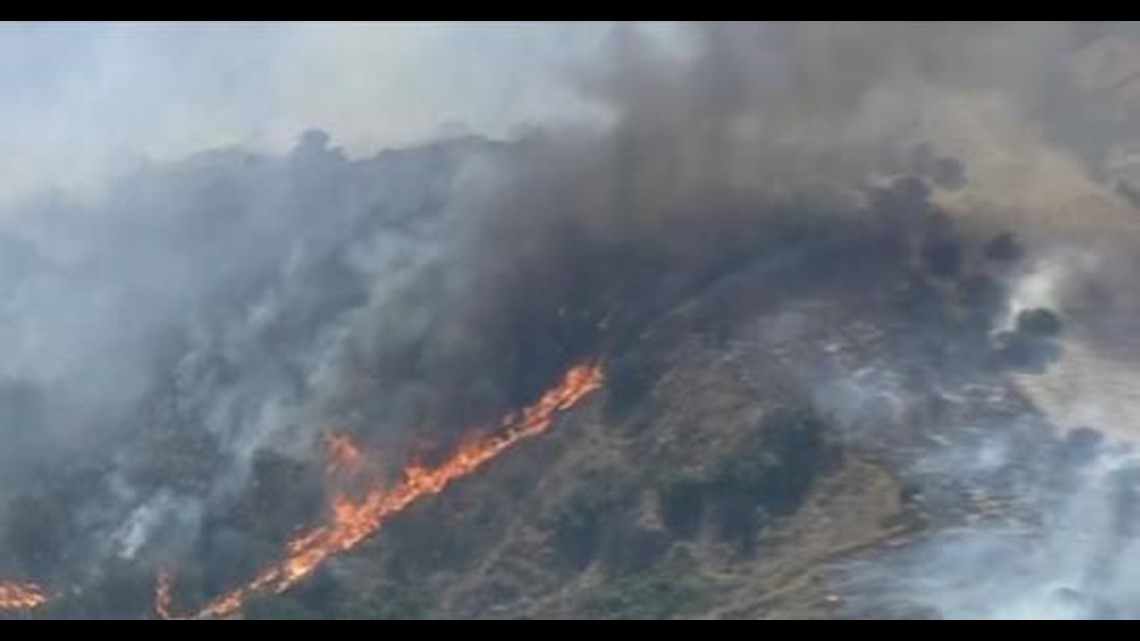 Homes burn as fire roars through Anaheim Hills