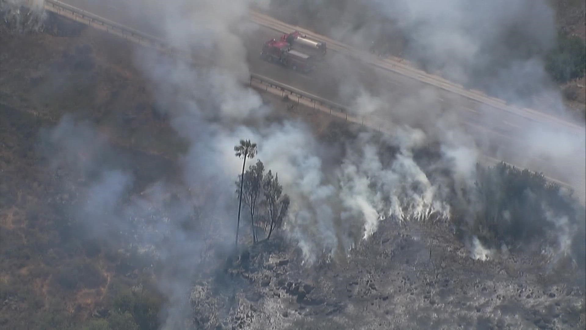 Firefighters stop spread of brush fire in San Carlos 