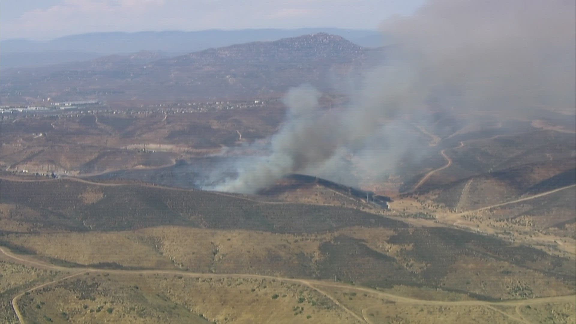 Firefighters are battling a brush fire burning in Sycamore Canyon between Poway and Santee.