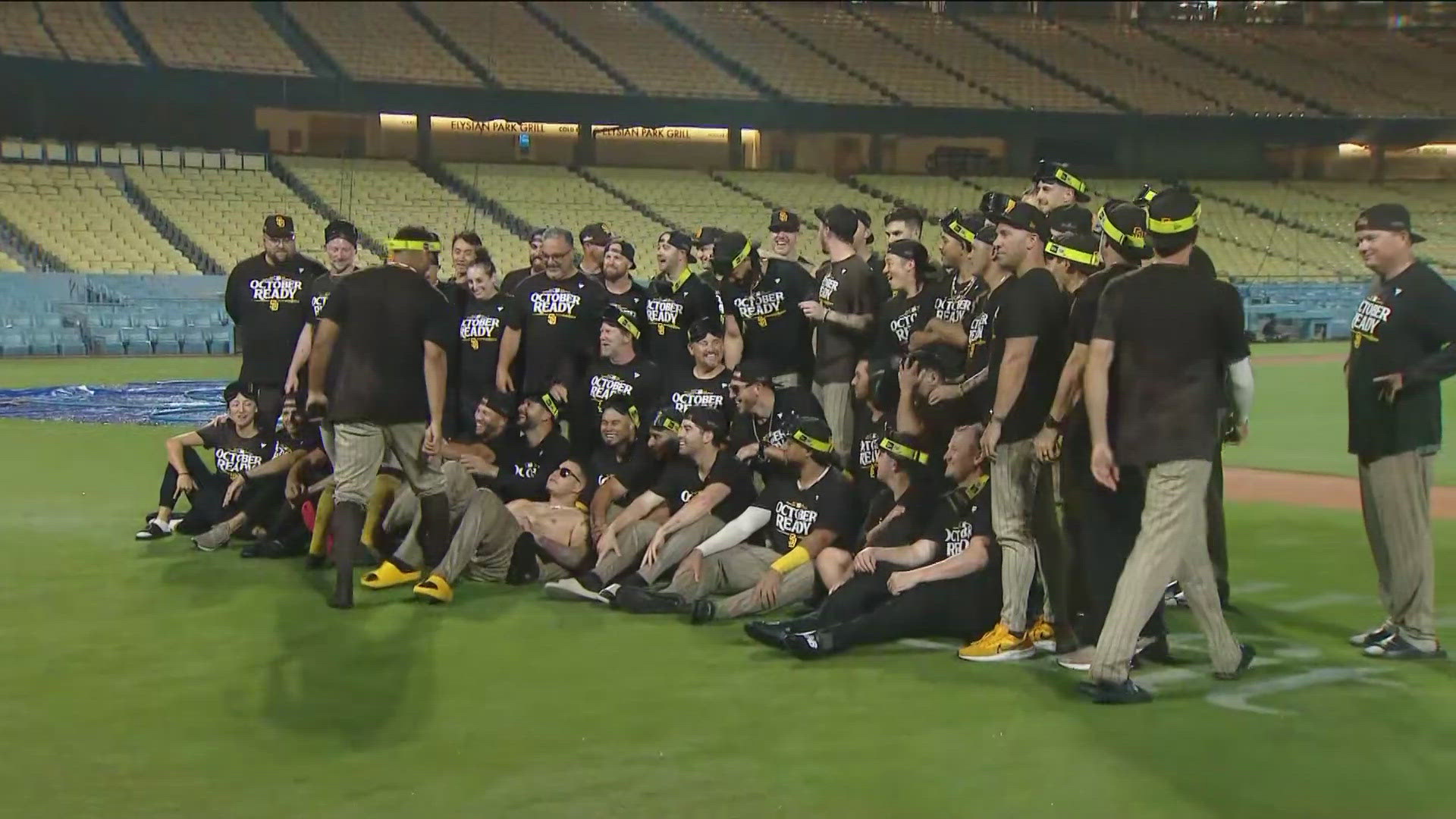 Playoff clinching team photoshoot on field at Dodgers stadium.