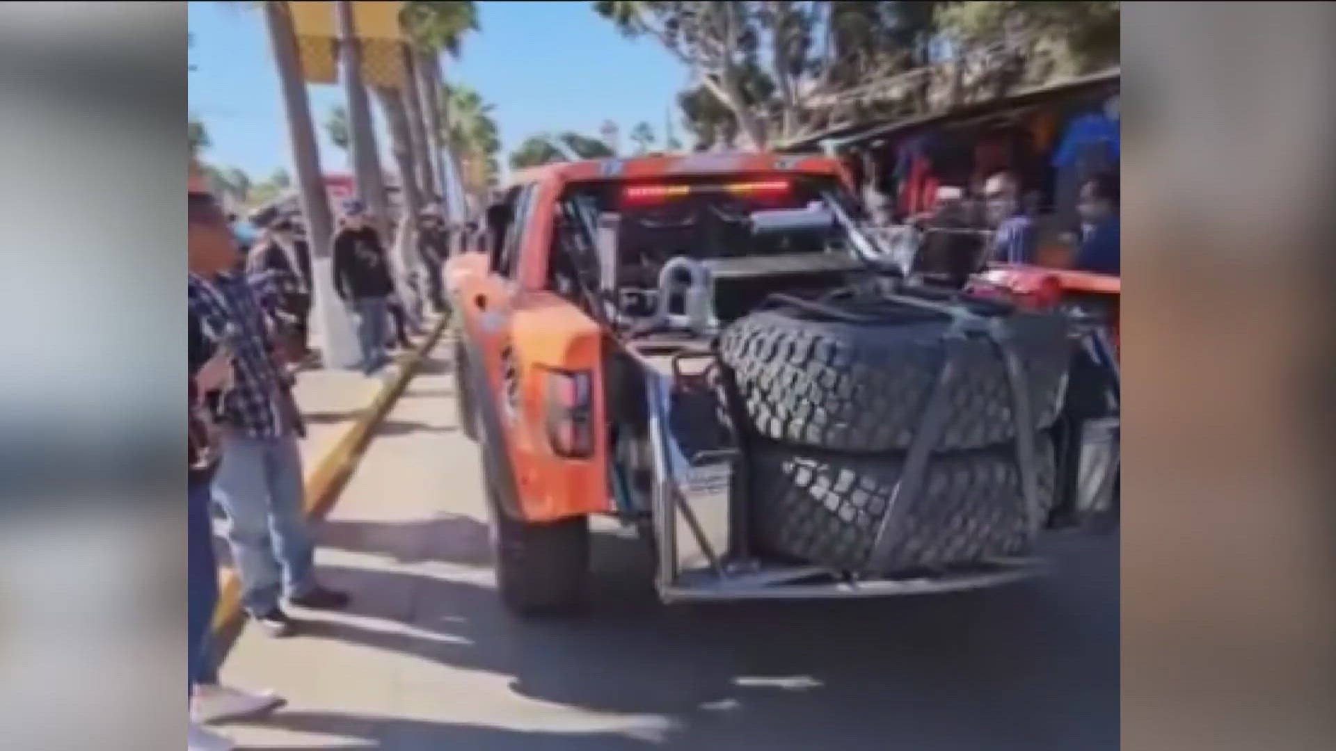 The driver of an orange trophy truck lost control while revving the engine, running over four bystanders.