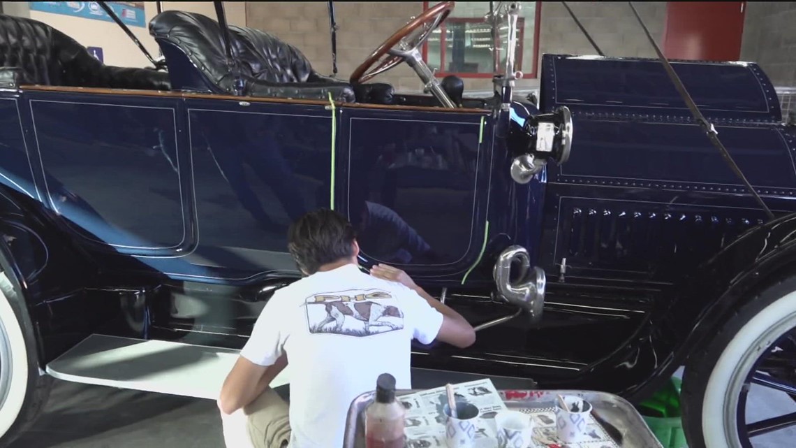 An inspiring teacher and students from Morse High School help place a classic Cadillac front and center at the Las Vegas Concours D'Elegance