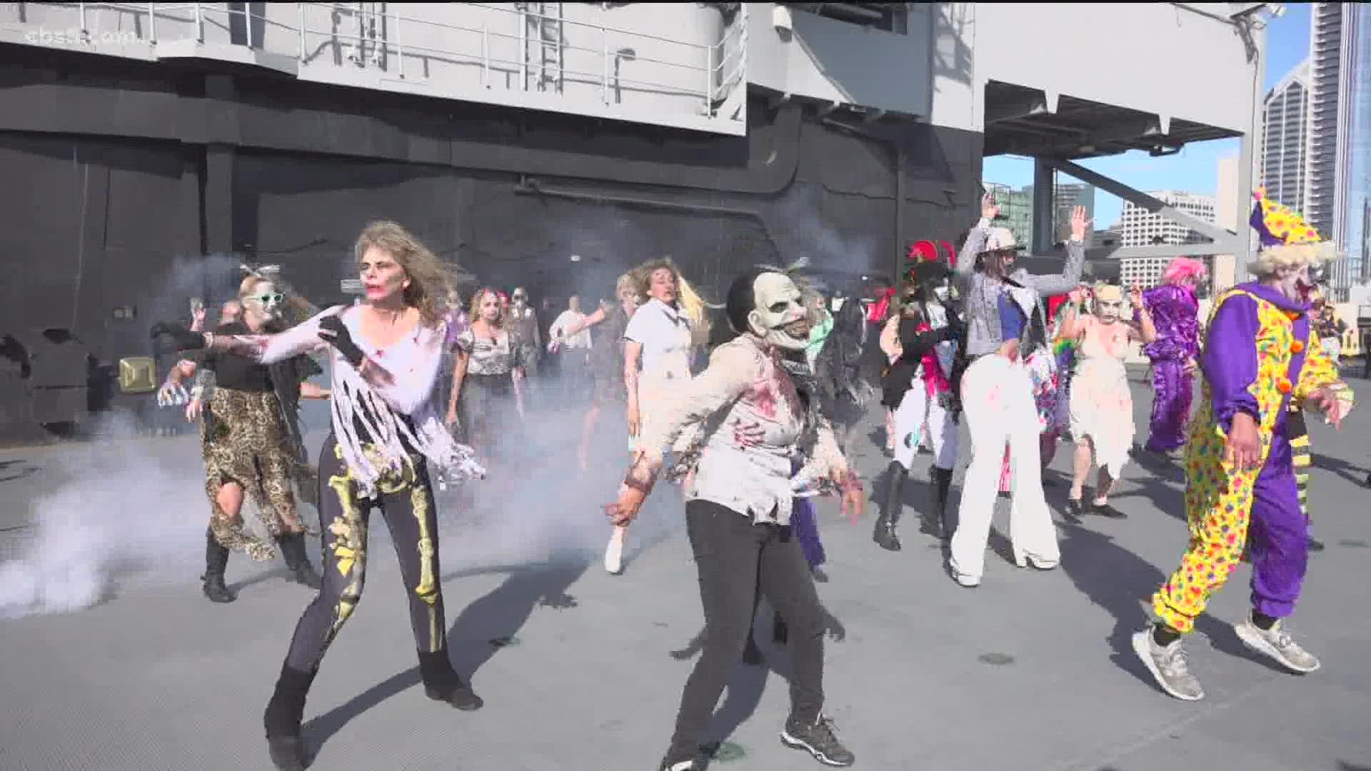The first annual “Thrill The Mil” event took place Sunday on the flight deck of the USS Midway Museum. Servicemembers and family performed the iconic zombie dance.