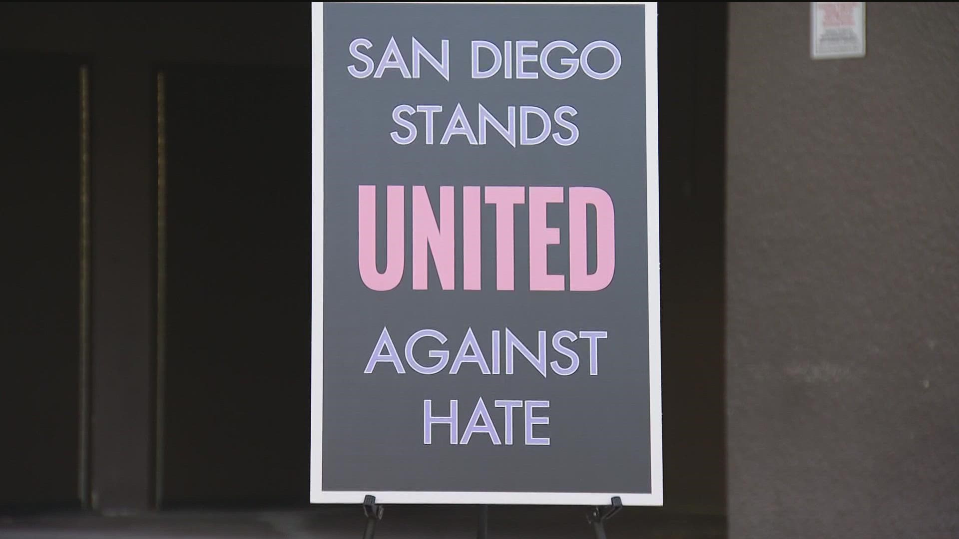 Mayor Gloria signs City of San Diego's proclamation against hate.