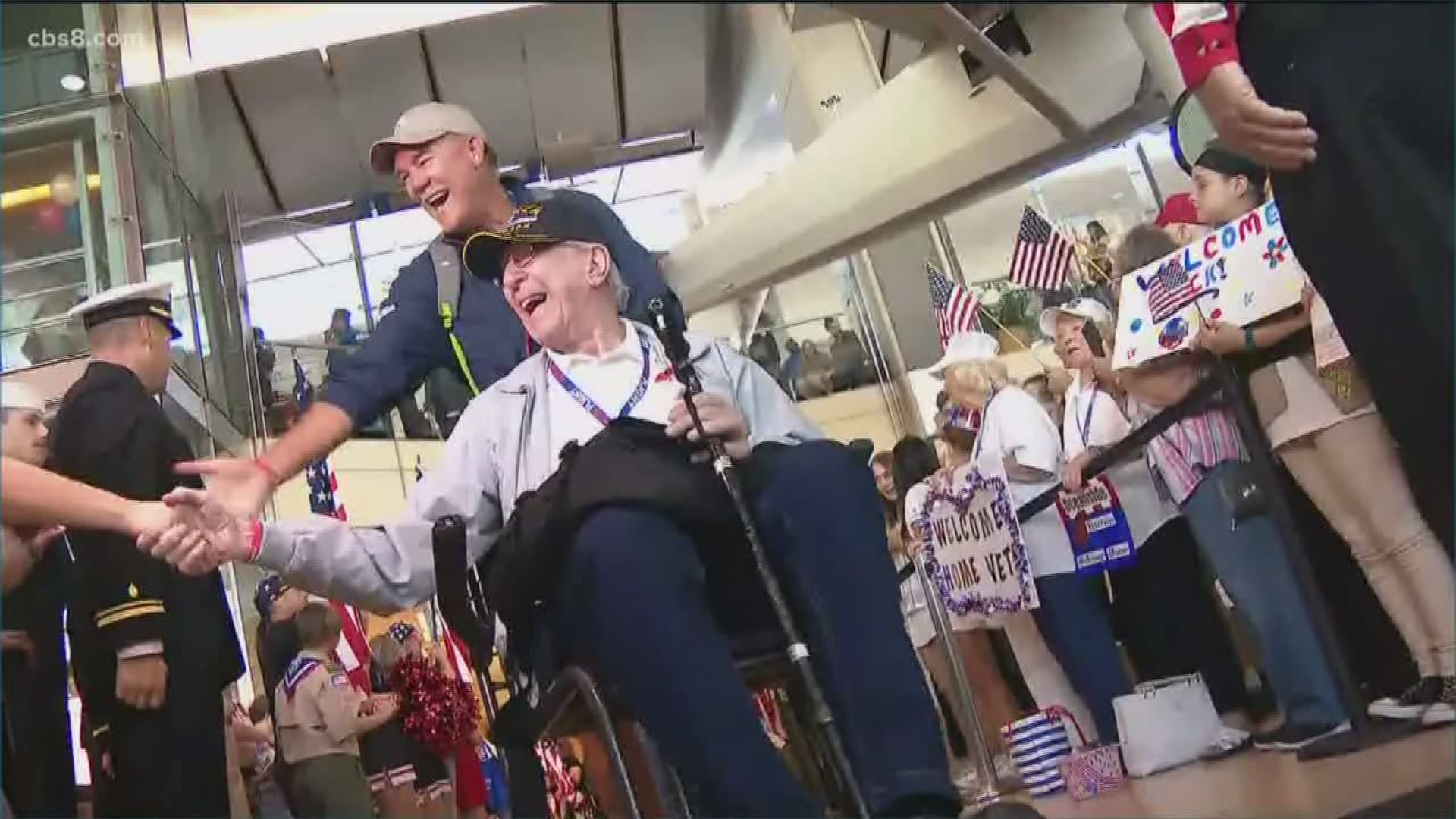 Hundreds of people lined up at San Diego International Airport to welcome the veterans home.
