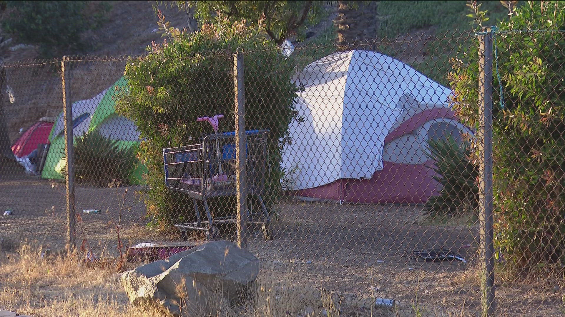 A homeless encampment along the freeway exit in Barrio Logan is one of the concerns brought up during Wednesday’s Community Planning Group meeting.