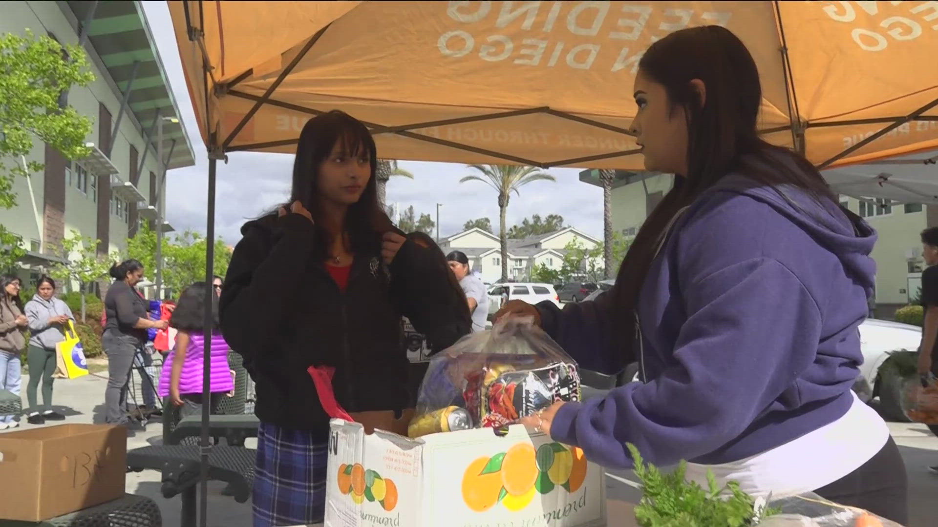 SDSU women's basketball players partnered with Feeding San Diego to distribute food at Lincoln High, addressing critical food insecurity in the community.