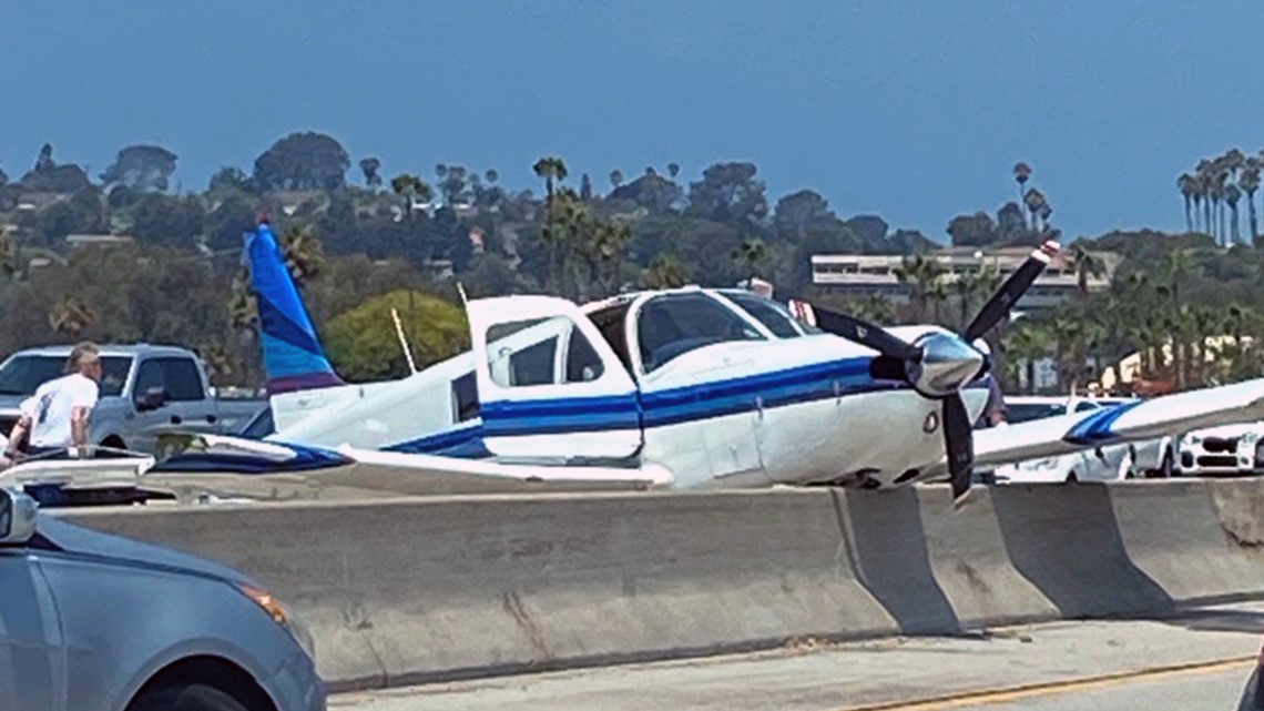 Small plane crashes into car during emergency landing in North