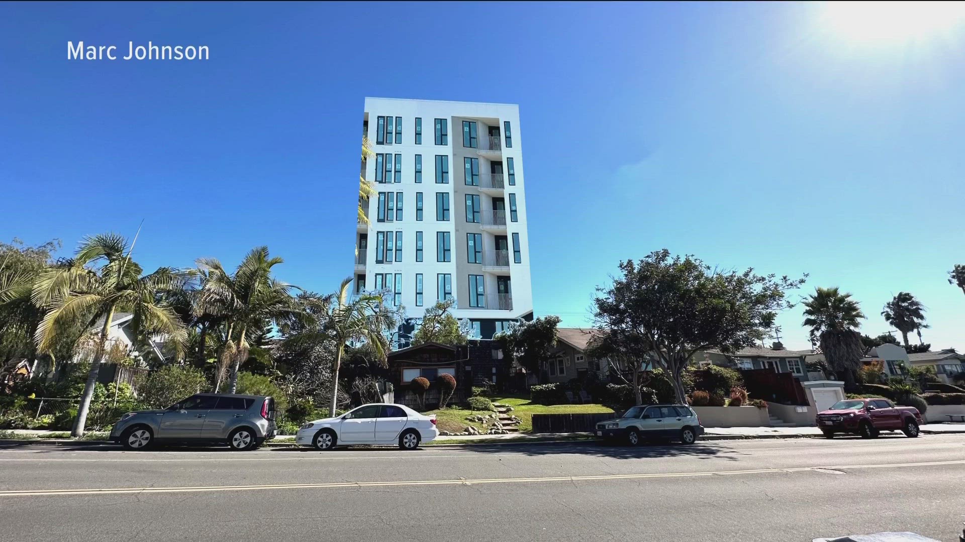 The eight-story residential building is set to go up on a street where the tallest building is just three-stories high.