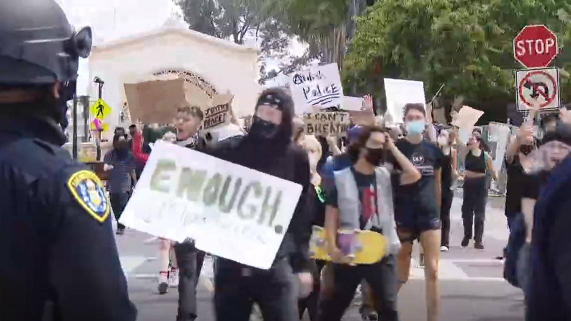 Protesters march through Balboa Park with San Diego police on hand ...
