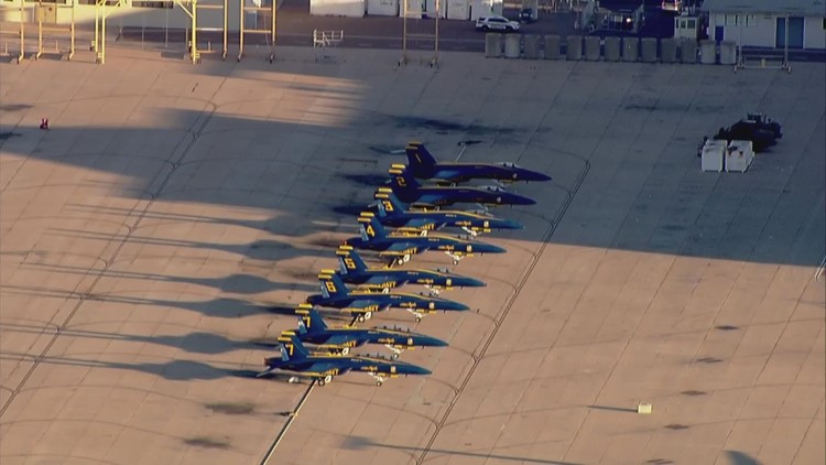 Chopper 8 flies over MCAS Miramar a day before the big show as planes get ready for take off