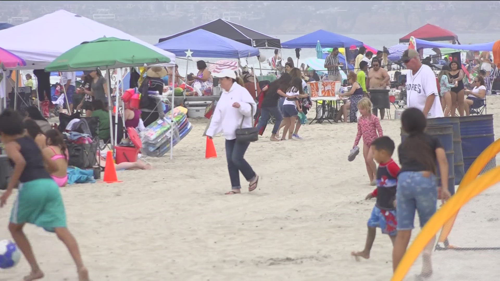 As temperatures remain hot, Labor Day visitors and residents look for relief at San Diego beaches.