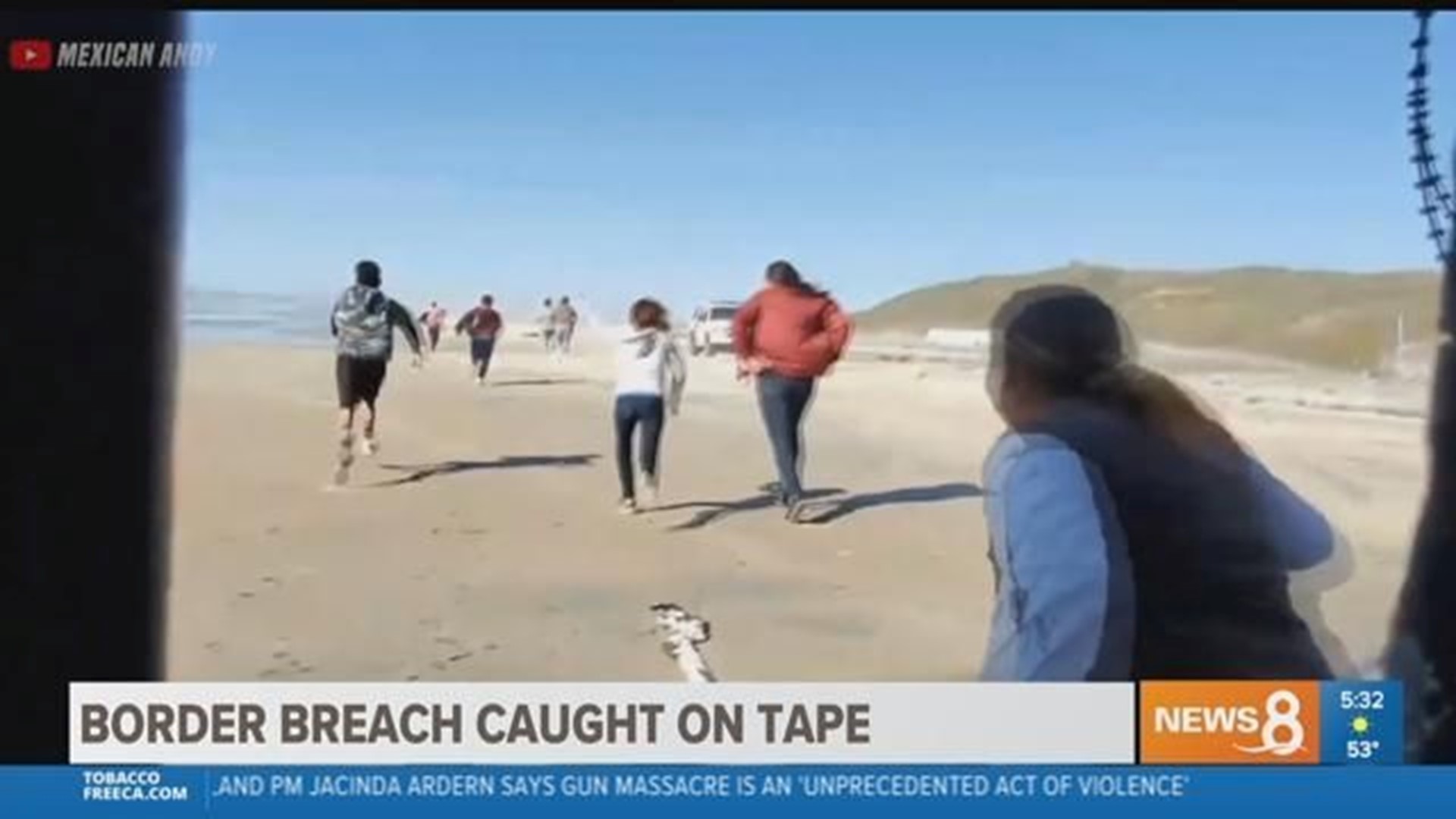 Dozens of migrants breach border wall in San Diego