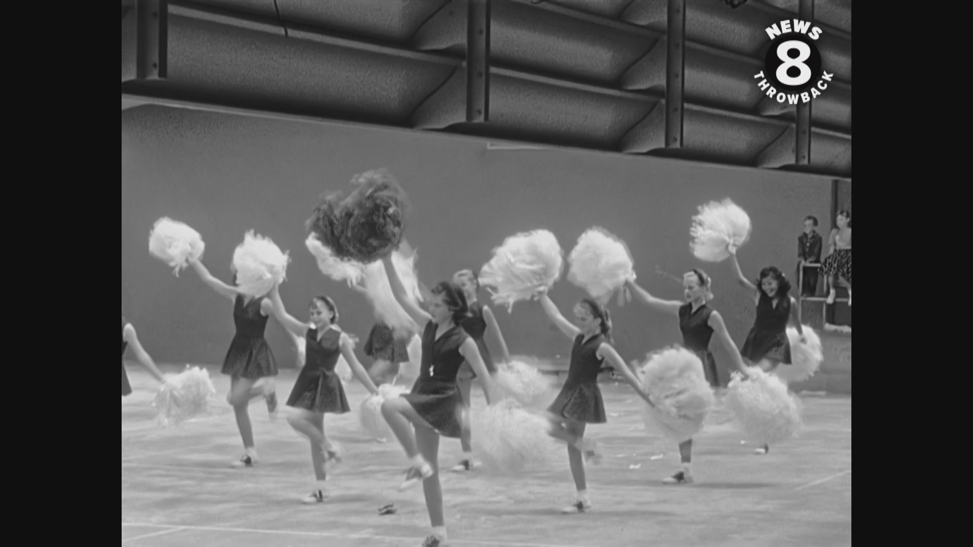 Pom pom girls rehearsing for the big fiesta pageant parade in July 1957.