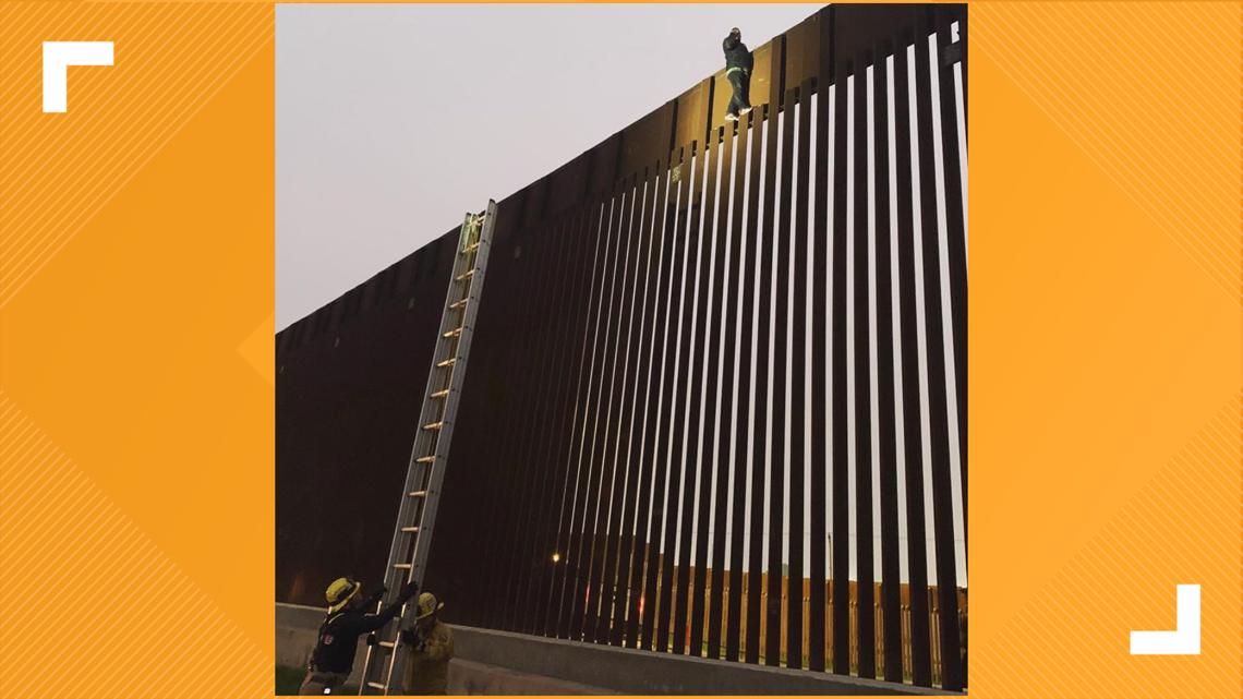 Firefighters rescue man stuck at top of Mexico US border wall | cbs8.com