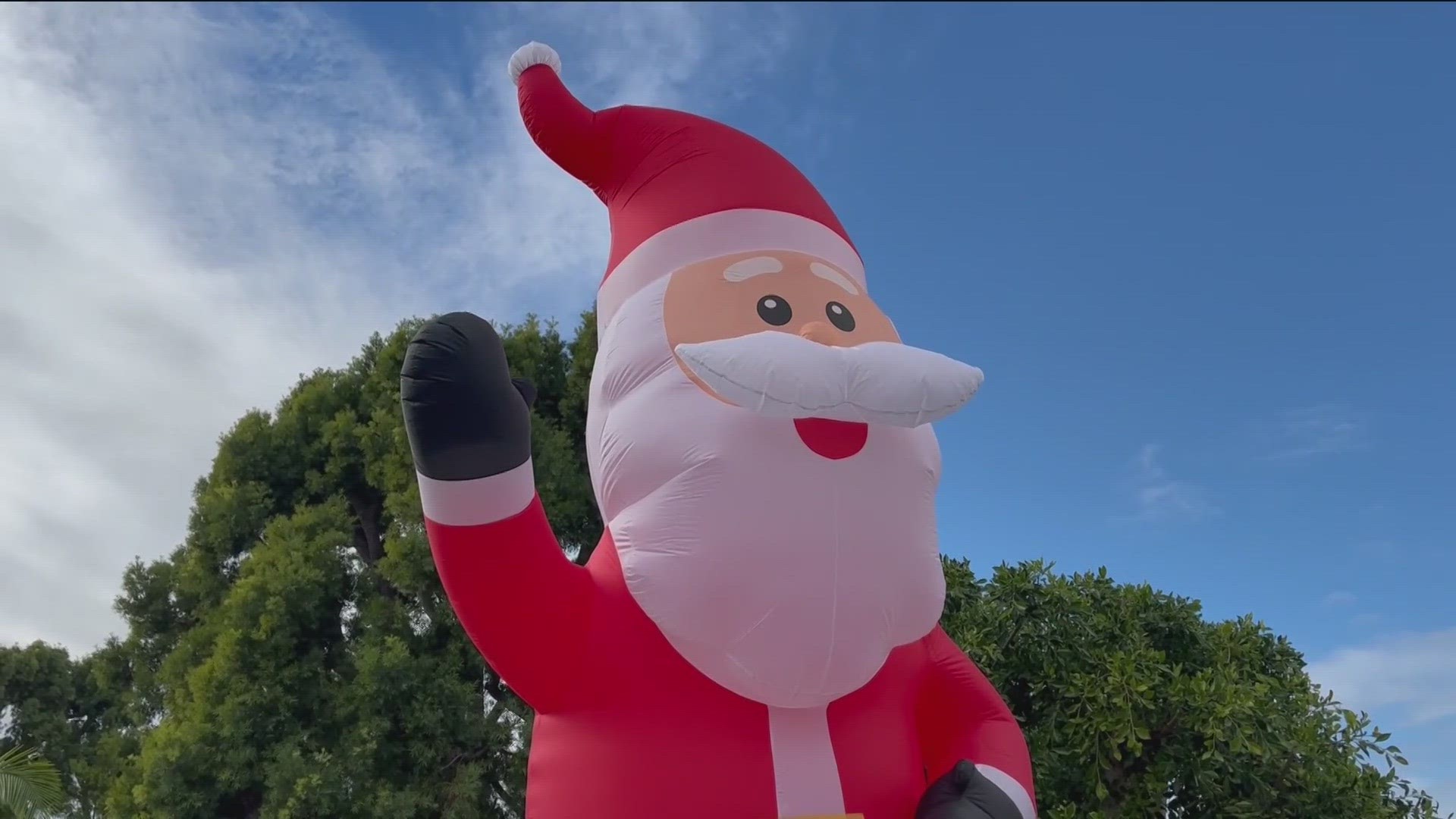 Surveillance video captures suspect stabbing inflatable santa, driving away