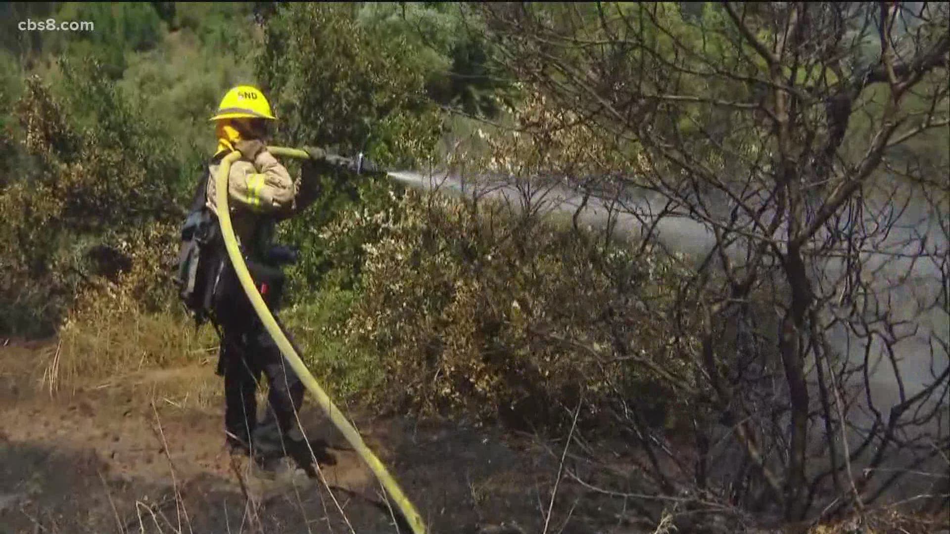 Fire crews are on high alert and thousands of San Diegans brace for power outages as wildfire conditions move into the county with a red flag warning in effect.