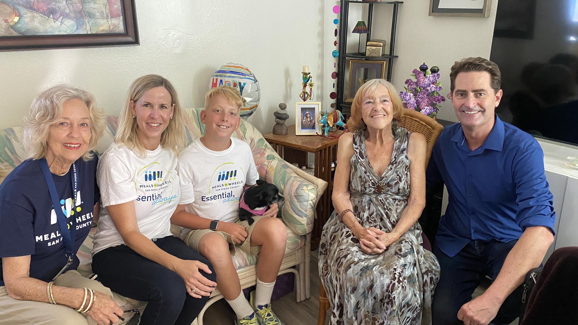 Meals on Wheels celebrates National Grandparents' Day with a three-generation delivery, highlighting its fight against hunger and loneliness among seniors.