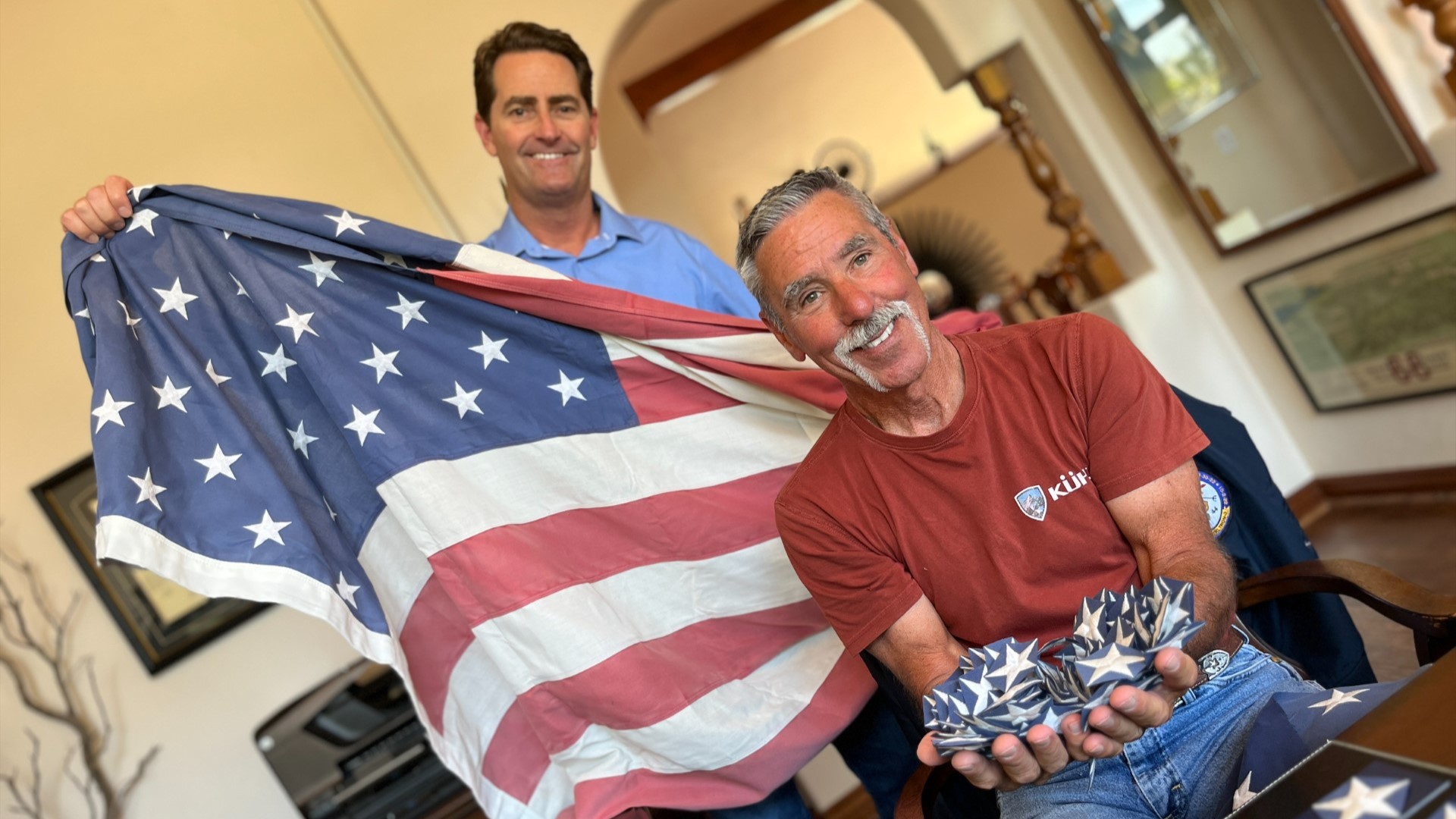 Dee Folse decommissions American flags from Miramar National Cemetery and gives away 'Stars' to spread patriotism.