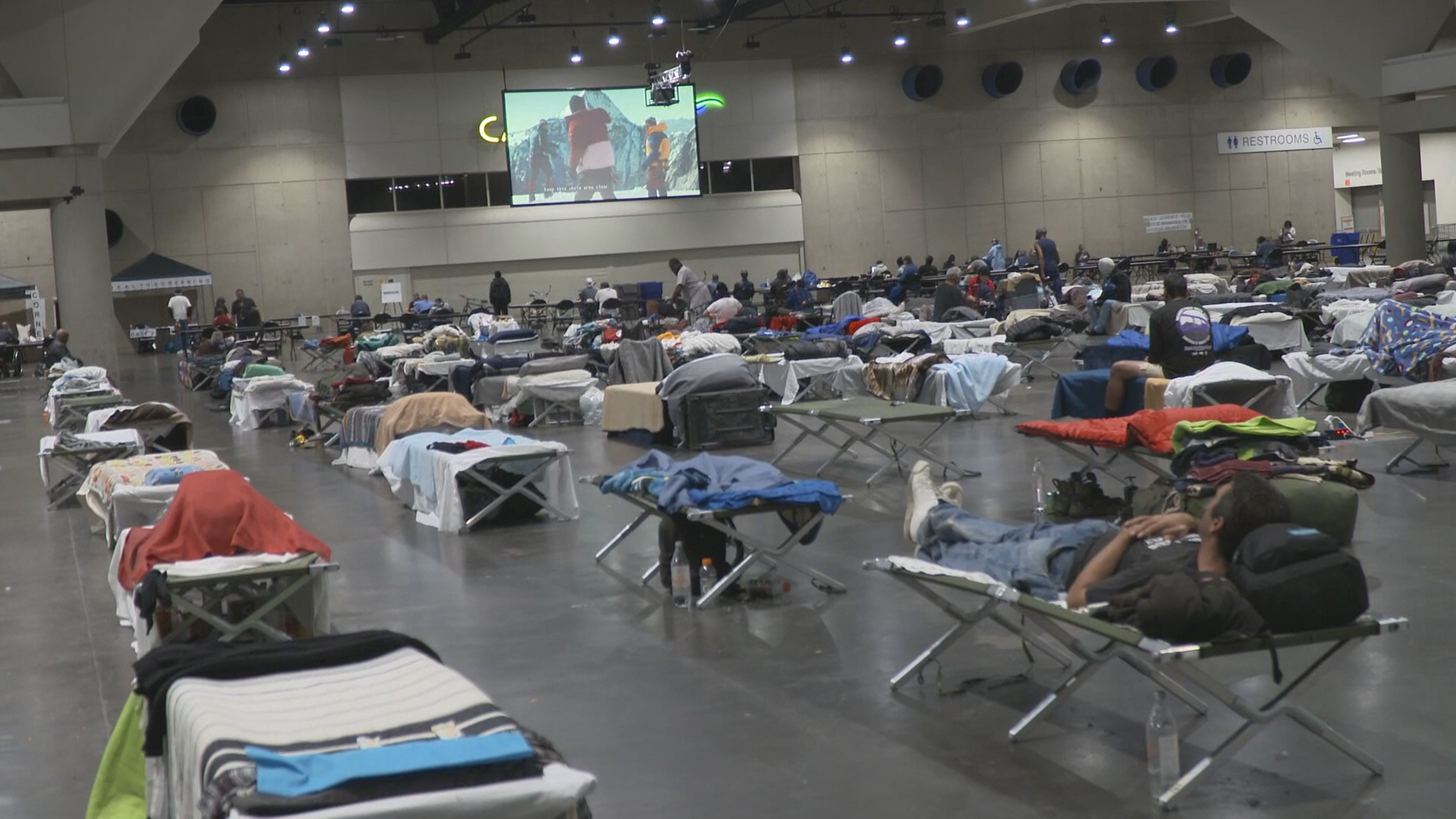 Authorities say that housing 900 people at the Convention Center is costing taxpayers roughly $5.7 million dollars a month, that’s about $211 each person a day.
