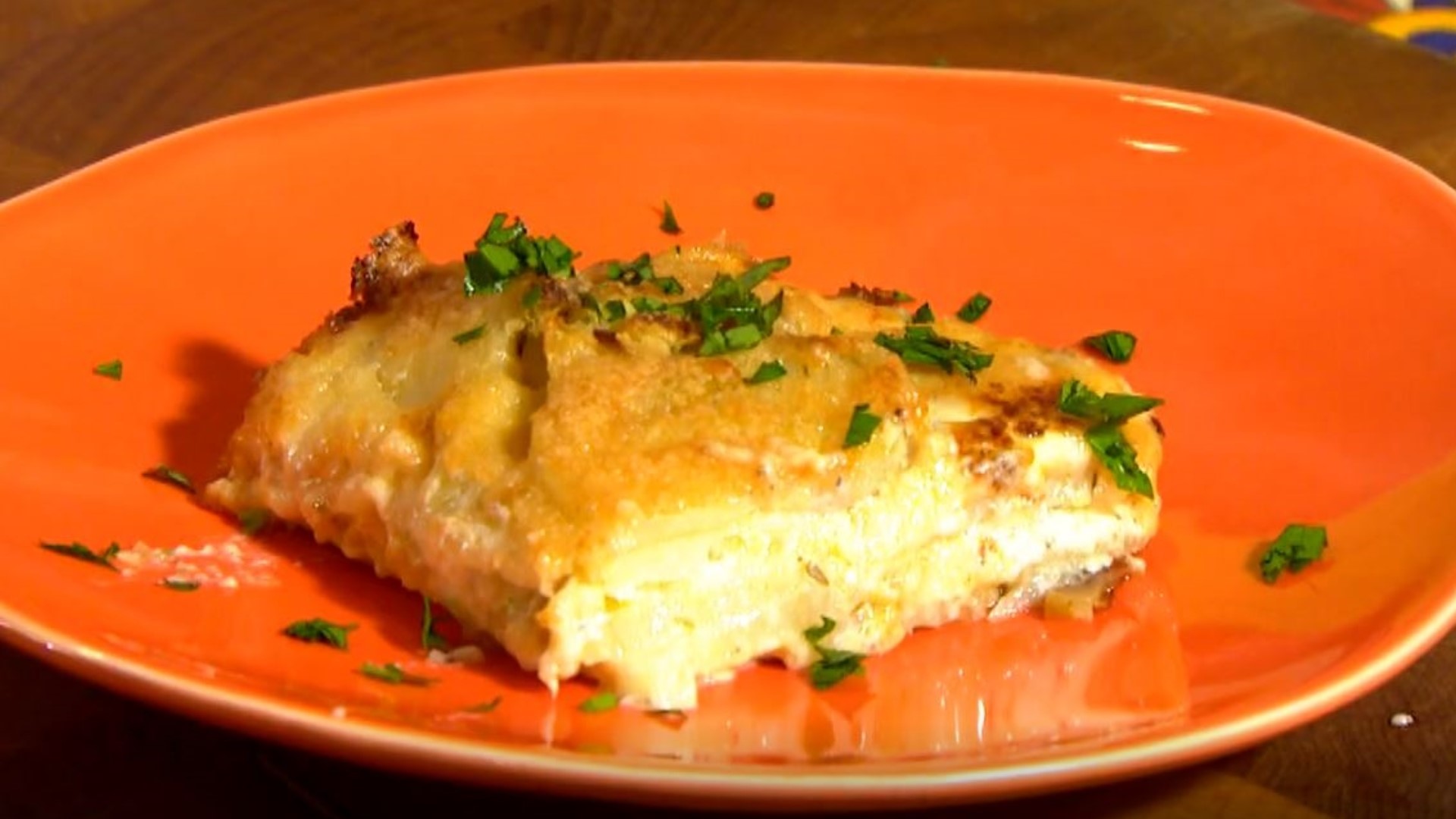 A dish that is covered with a layer of crusty, bubbly cheese.