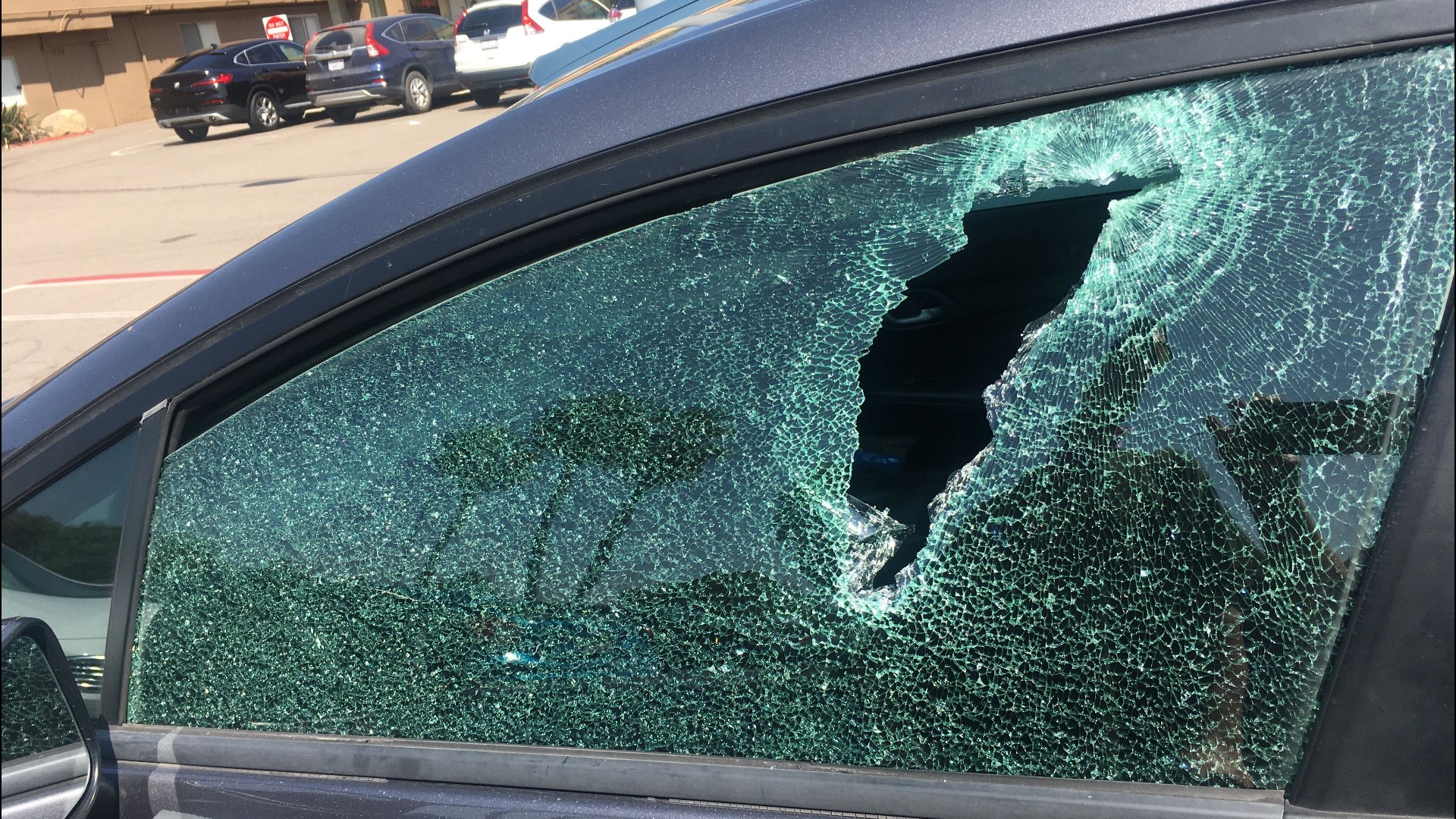 A San Diego driver says an unprovoked road rage incident led to a man slamming into his car and throwing a hammer through his window.