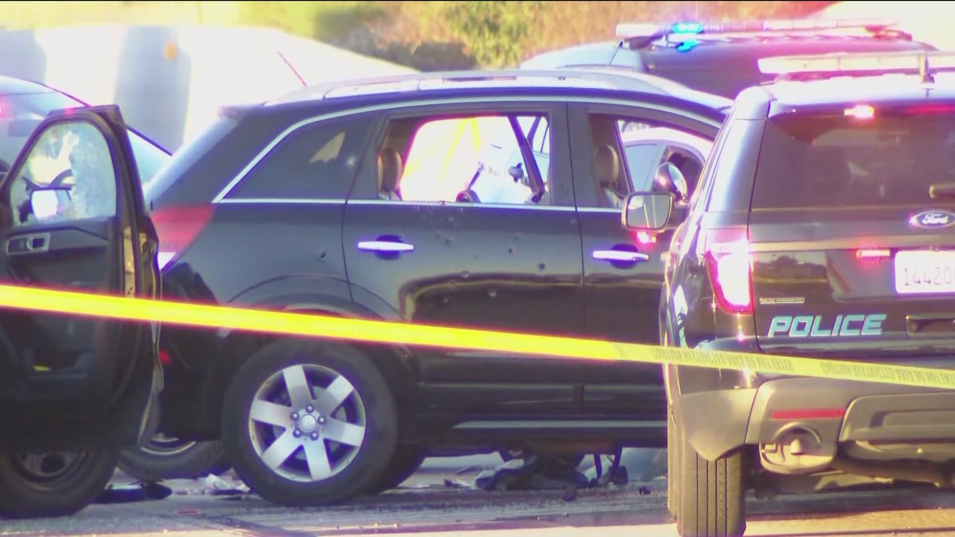 A vehicle pursuit ended in a multi-car crash on I-15 near SR-163, leading to gunfire and at least one person injured.