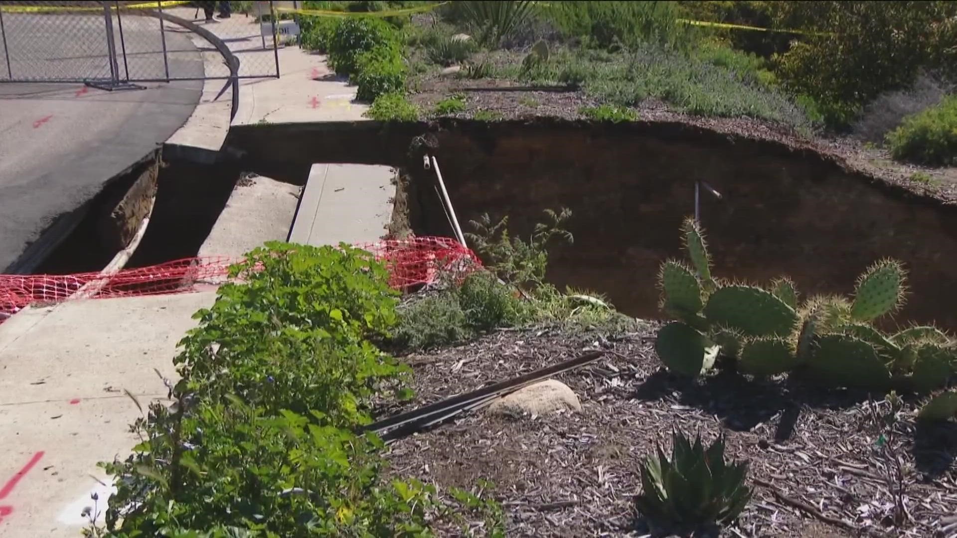 A sinkhole formed after torrential rain in the Cardiff neighborhood of Encinitas. The hole is near Lake Drive, south of Birmingham Drive.