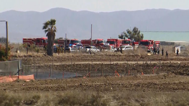 Massive fire burns in Otay Mesa auto wrecking yard | cbs8.com