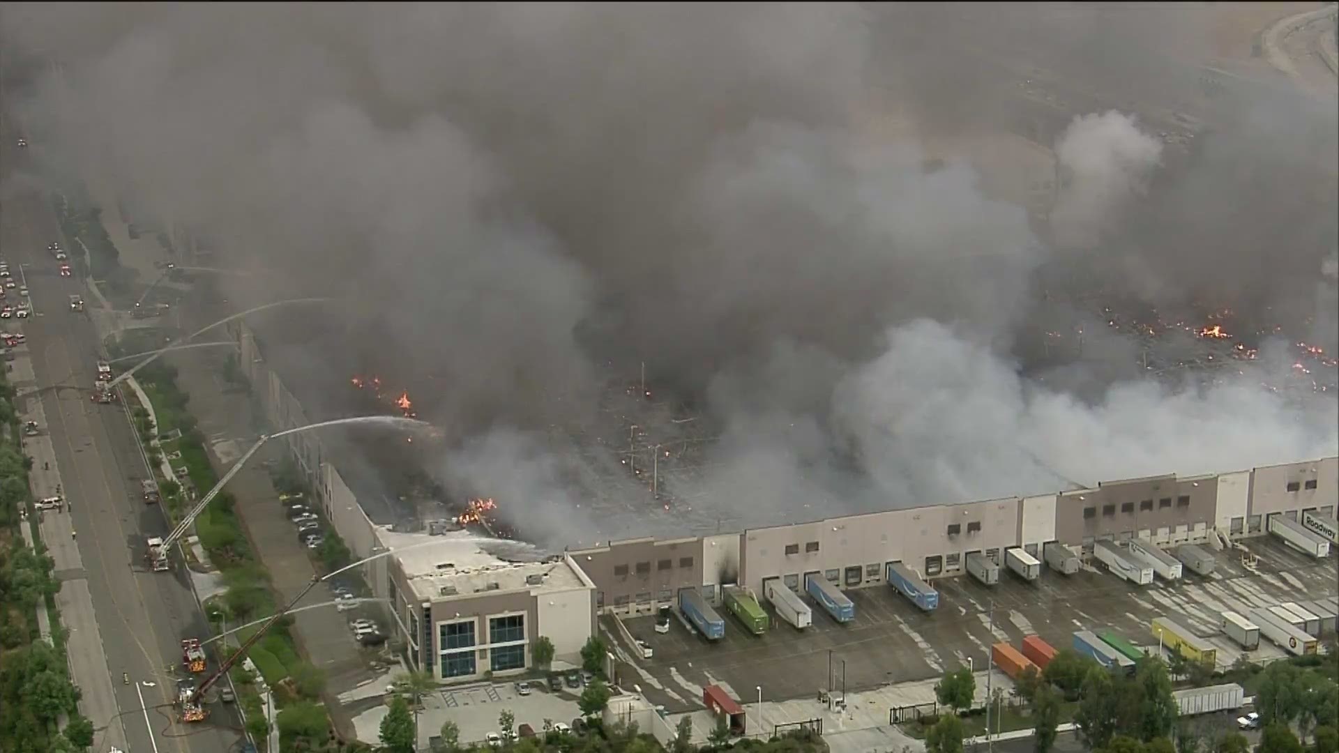 A large three-alarm commercial fire engulfed an Amazon Distribution Center in Redlands early Friday morning.