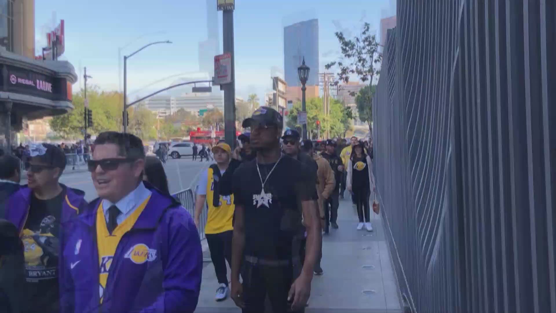 Our News 8 photojournalists captured fans wrapped around the STAPLES Center waiting to pay their respects to Kobe and Gianna Bryant this morning.