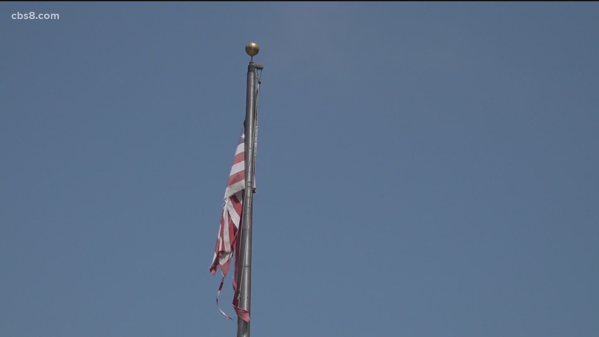 San Diegans are upset some tattered flags on display at a historic building downtown have yet to be replaced or repaired.
