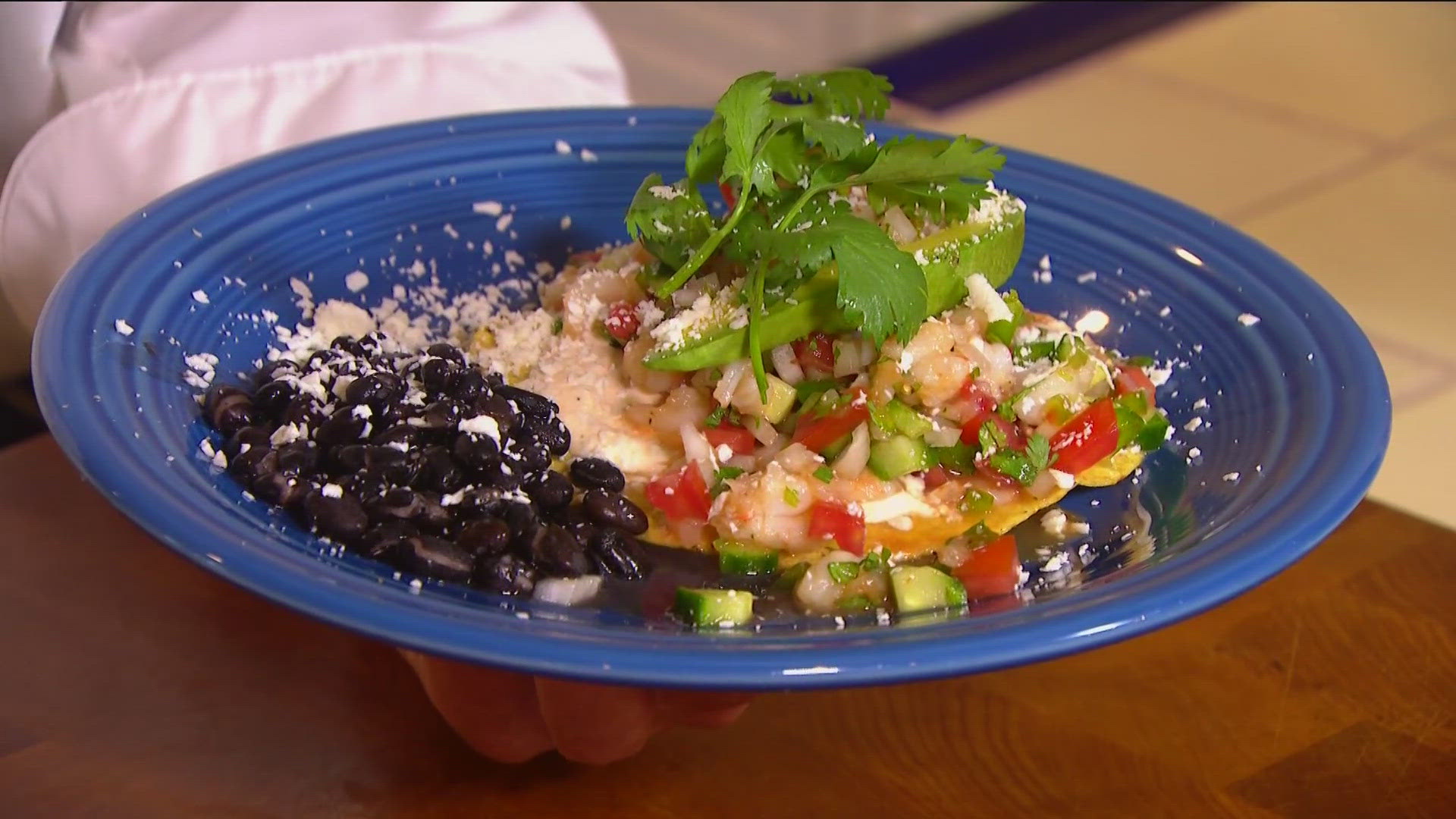 Shrimp ceviche tostadas delight with citrus-marinated shrimp, fresh veggies, and spicy mayo on crispy shells.
