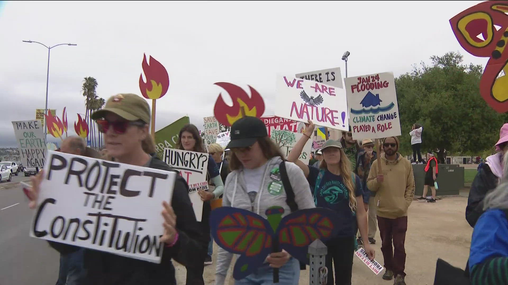 More than 1,000 people marched through Downtown Saturday calling for climate action at local and federal levels. 