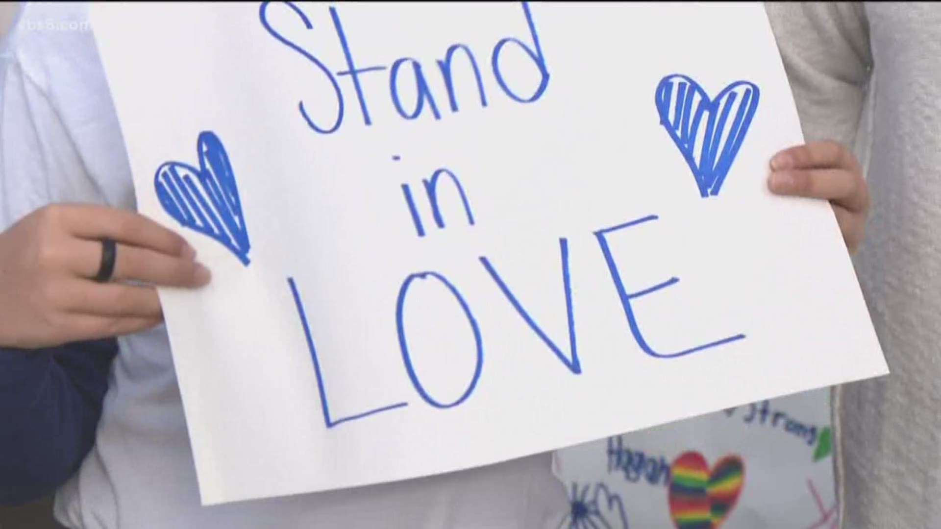 The vigil was organized by a group called Moms of Poway who lined the same street Friday in a show of support.