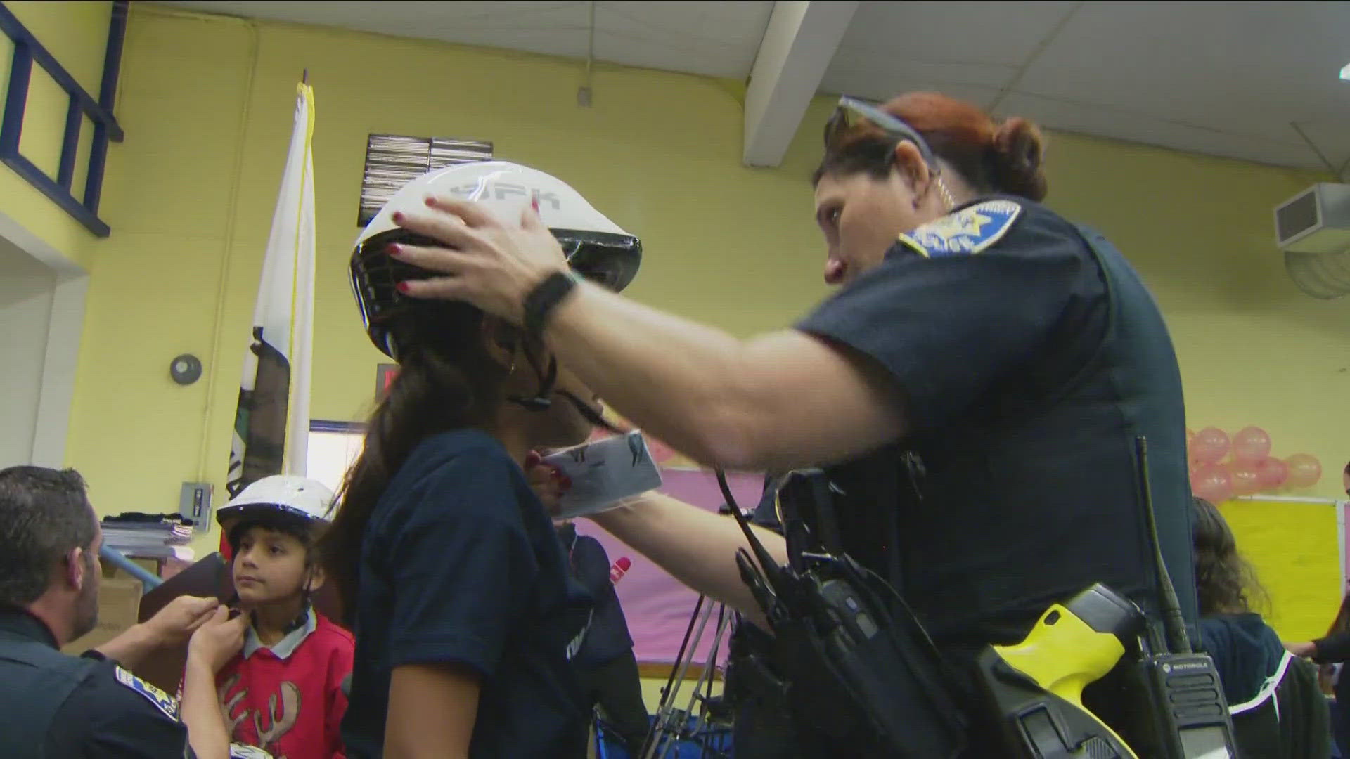 San Diego Unified Police passes out bikes and gifts to students at Horton Elementary.