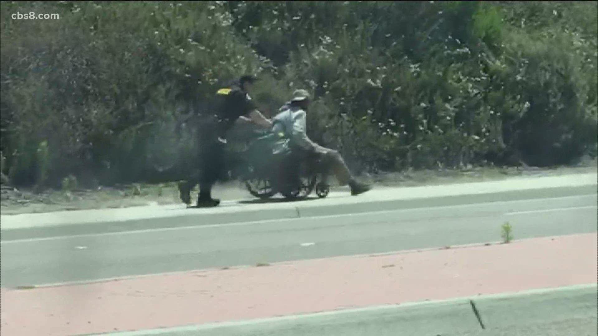 Officer Chris Marr pushed the man up a steep incline on El Camino Real in the afternoon sun.