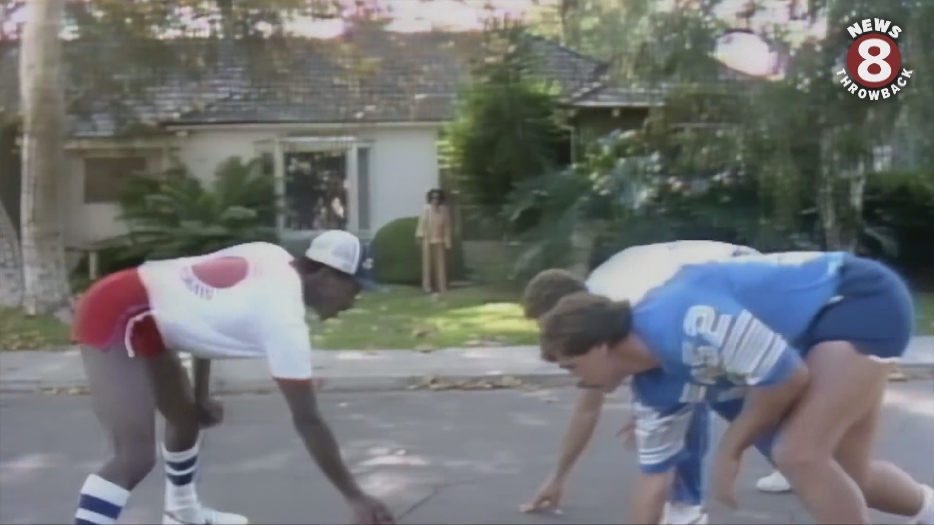 San Diego Chargers play football in the street in front of Larry Himmel's Talmadge home. 1980 something.