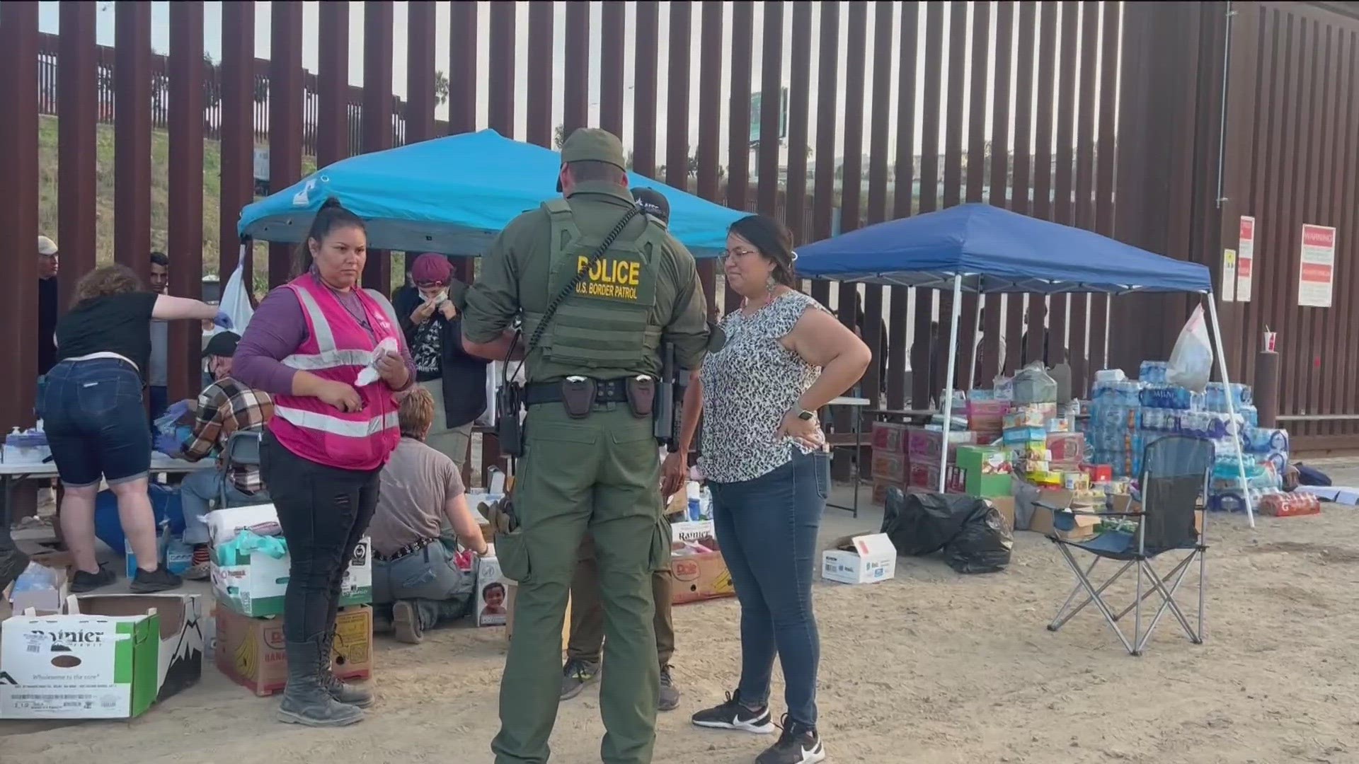 Border Patrol agents loaded some people onto a bus to get them processed Tuesday night. Others were given wristbands after checking their legal documents.