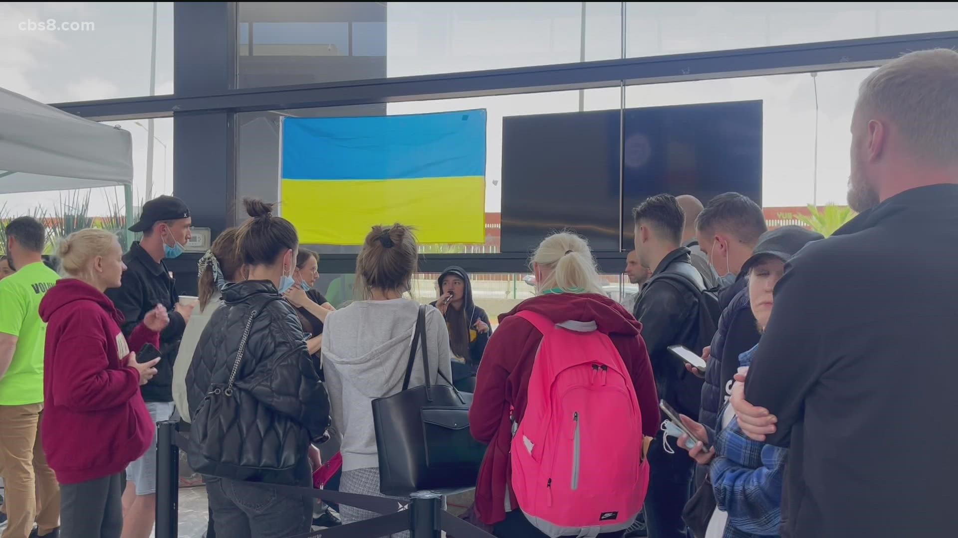 Volunteers set up 'help area' inside Tijuana International Airport to
