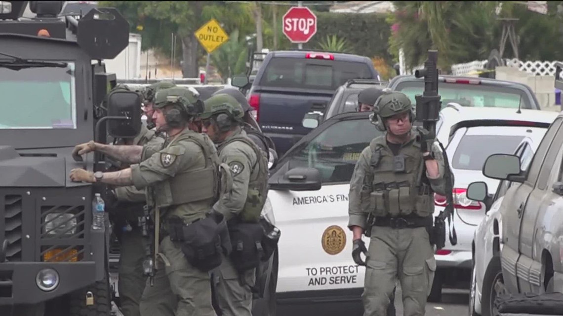 SWAT in standoff with armed man who allegedly threatened neighbor ...