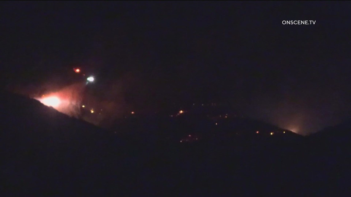 Firefighters stop spread of brush fire burning in Rancho San Diego at ...