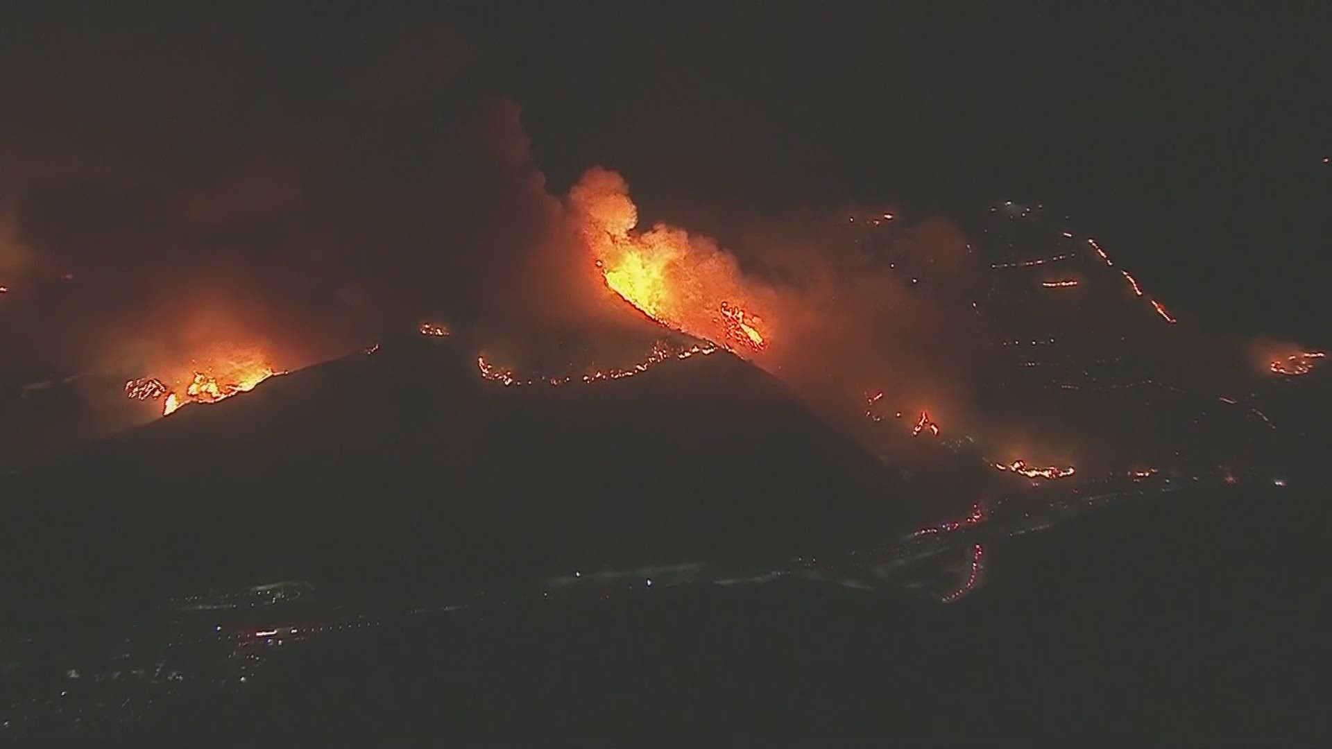 A wildfire erupted on a hillside near the Getty Center museum in the Sepulveda Pass early Monday morning.