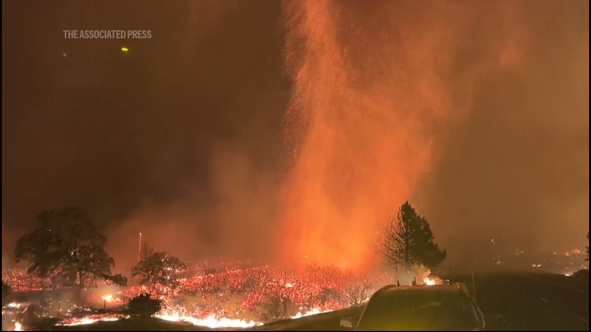 Thousands of firefighters were battling a wildfire in northern California on Saturday that exploded in size, scorching an area about the size of Los Angeles — one of