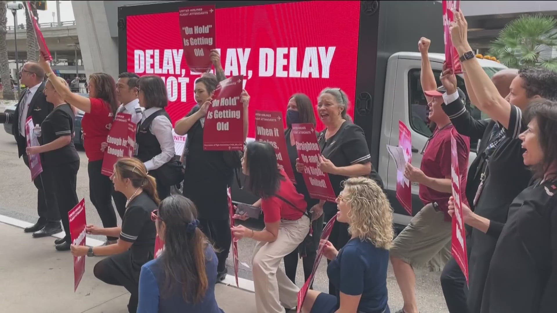 Dozens of flight attendants rallied outside of Terminal 2 at the San Diego International Airport Thursday morning.