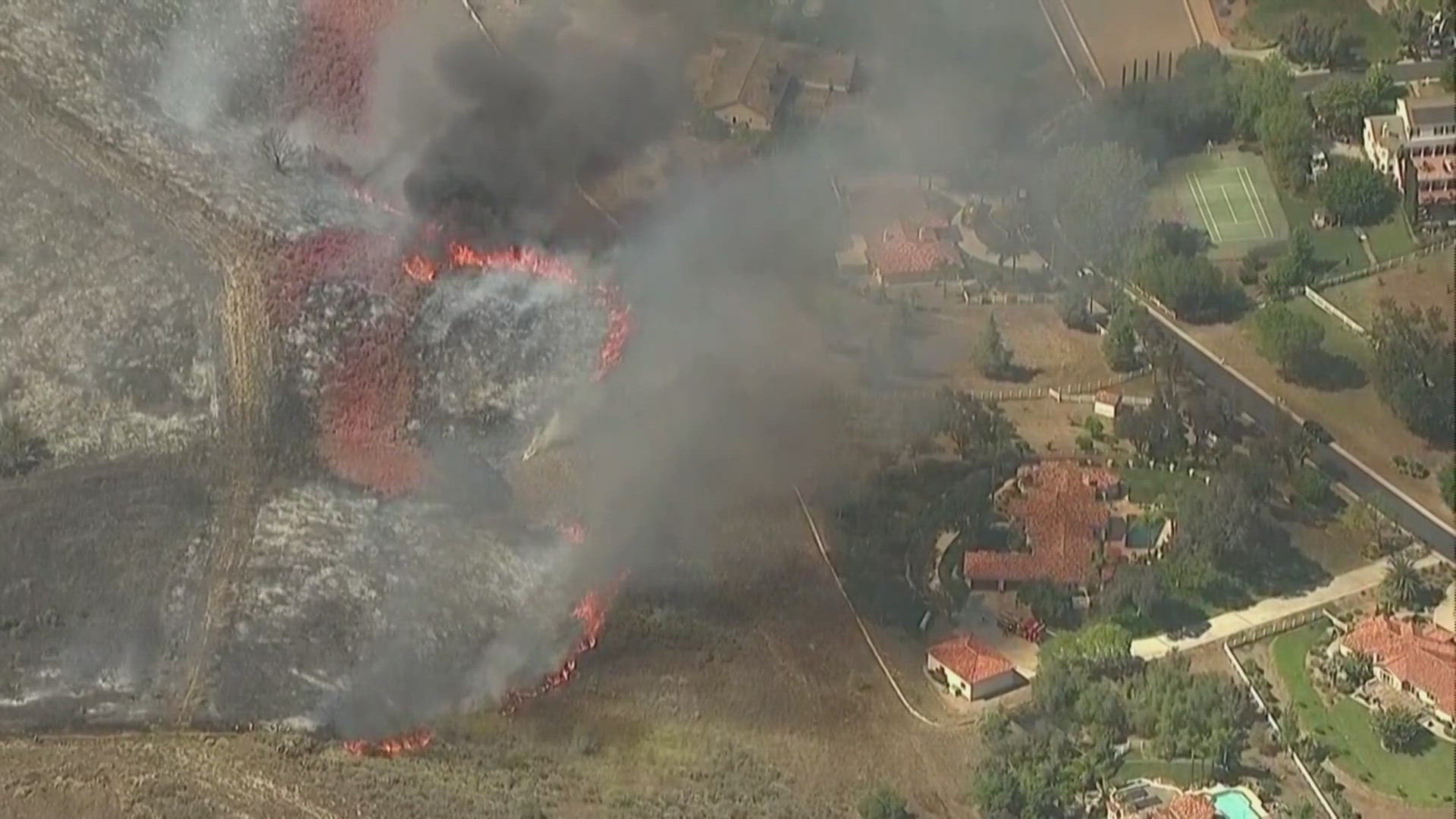 Firefighters were battling a brush fire in Bonsall in North San Diego County, near SR-76 and South Mission Road, on Monday.